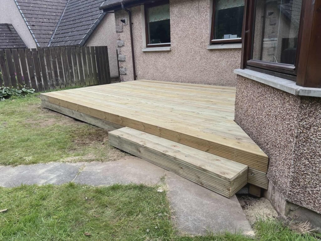 Newly built wooden decking outside a home.
