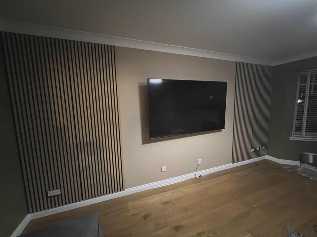 Wall panels installed with a securely mounted TV in a modern living room.